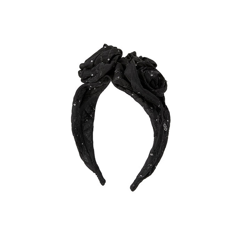 Giorgia - Serre-tête en tissu noir orné de sequins et de fleurs.