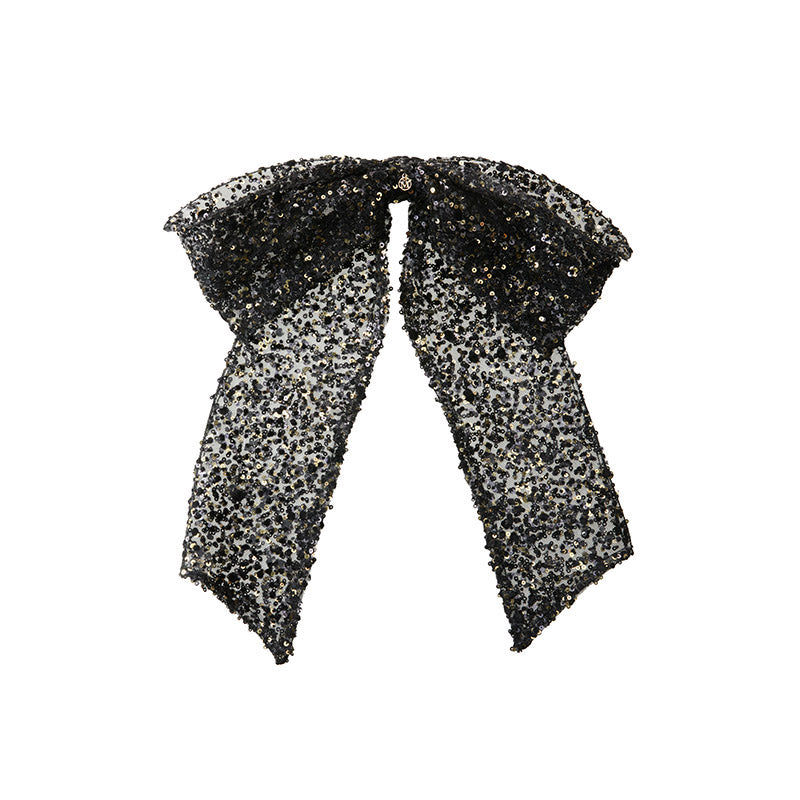 Wendy - Nœud en velours noir orné de sequins.