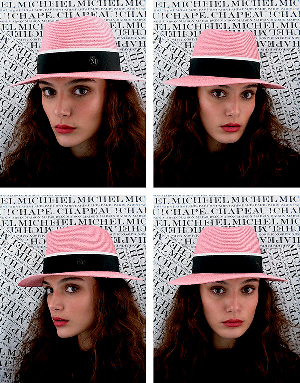 André - Fedora en paille rose floral avec un ruban noir et blanc.