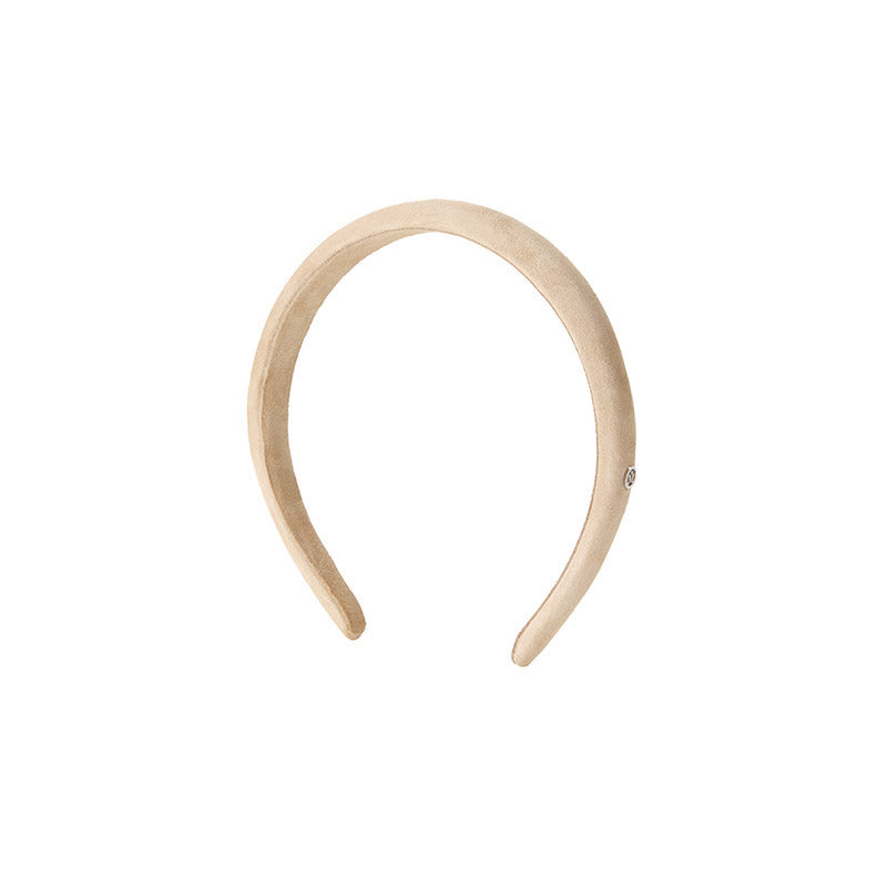 Hattaway - Accessoire de tête en cuir beige.