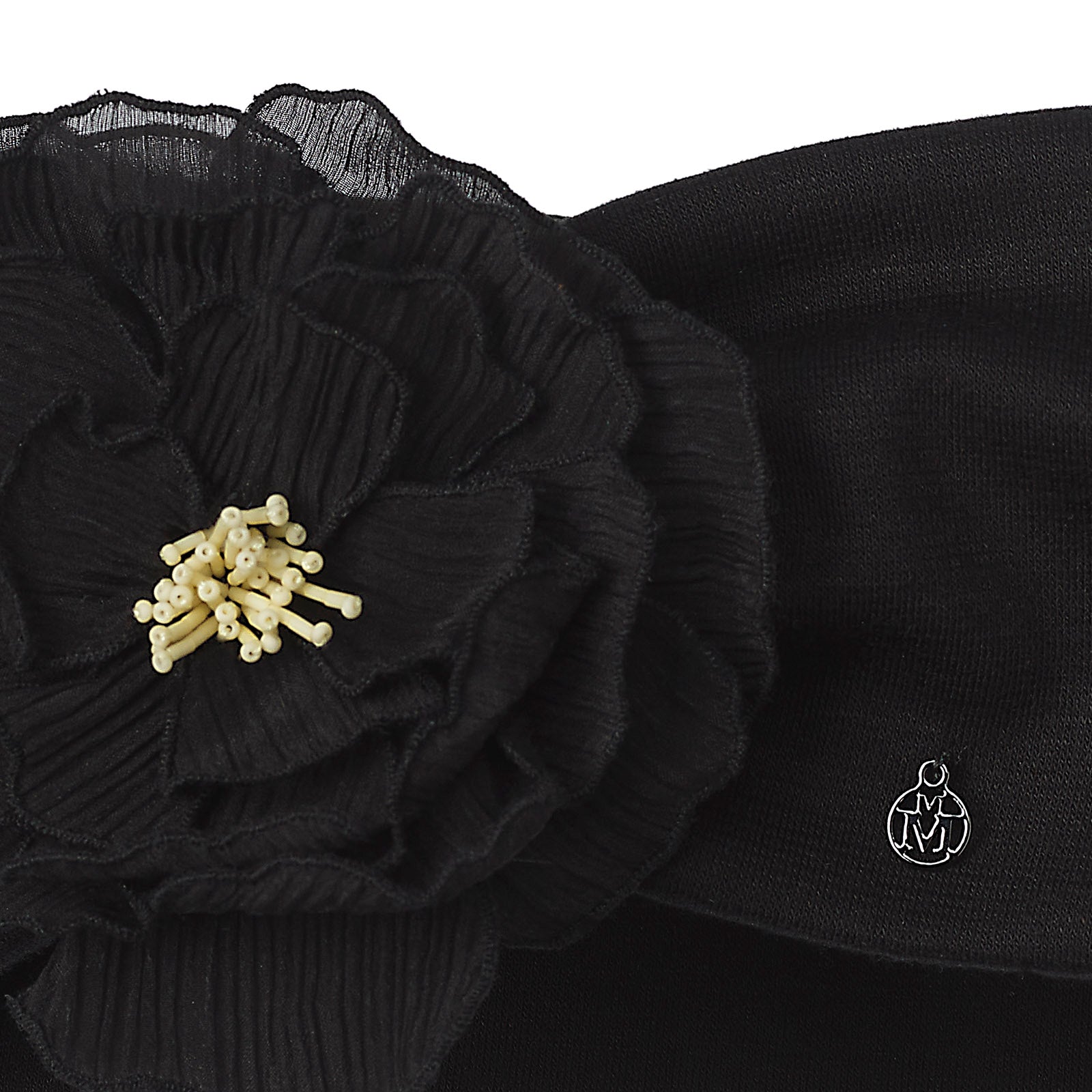 Kristin - Bandeau noir avec une délicate fleur en crêpon.