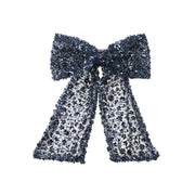 Wicole - Barrette en tulle bleu avec des sequins brodés.