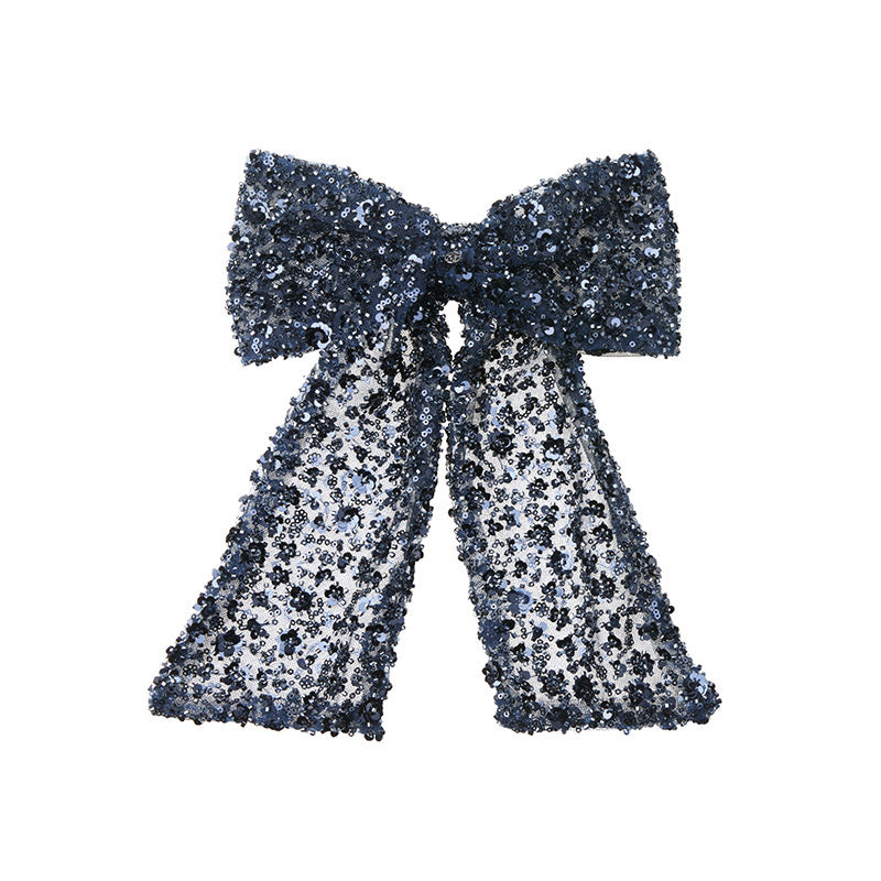 Wicole - Barrette en tulle bleu avec des sequins brodés.