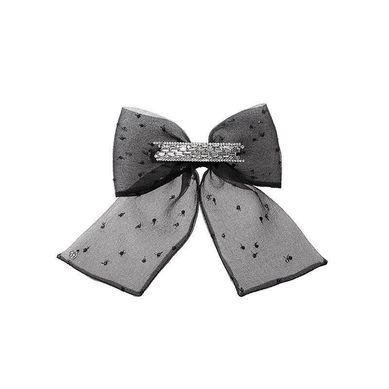 Willa - Noeud fait en organza noir avec des plumetis argentés et des strass.