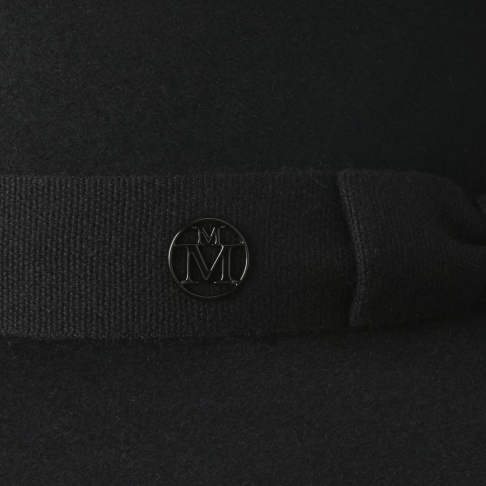 Fedora hat in black felt embellished with a tone on tone ribbon